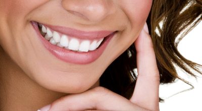 Closeup of a woman with perfect teeth smiling